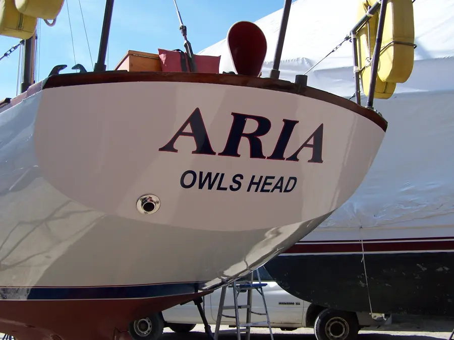 Stern of the sailboat Aria, Owls Head, under winter cover