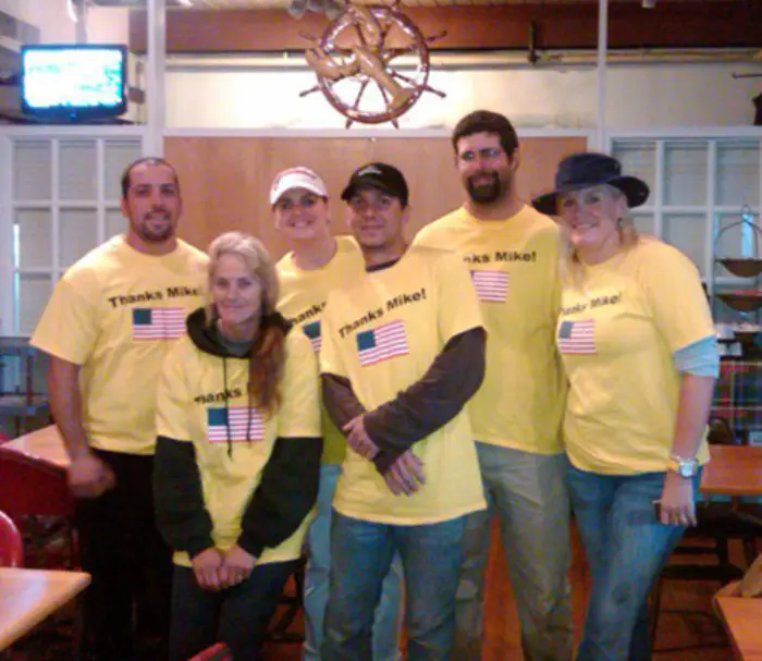 The Knight Marine Service crew in matching yellow shirts